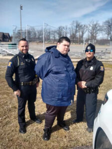 Danny Justice, Andy Starzac and an unamed police officer.