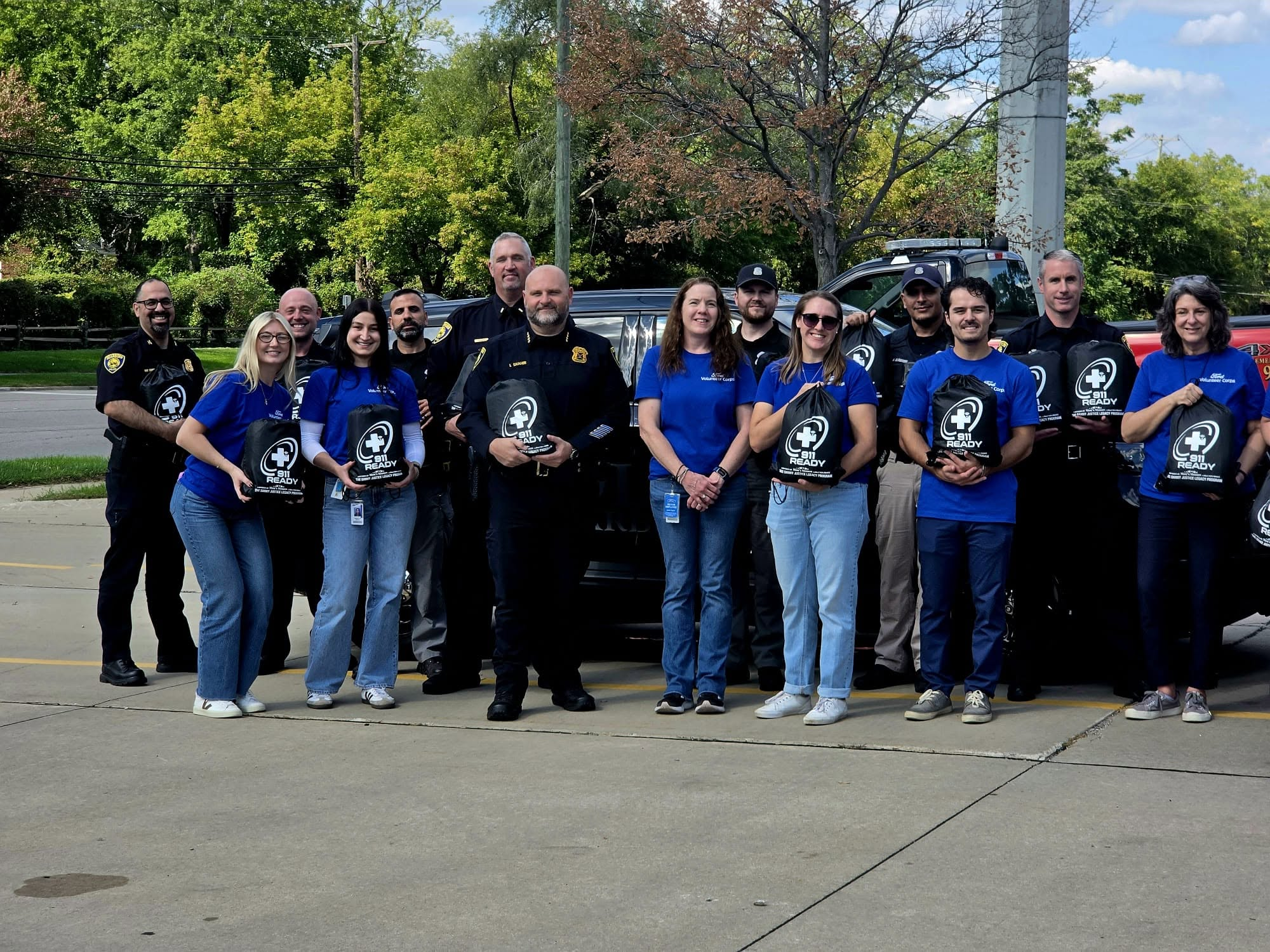 first responders and ford volunteers around 911ready bags